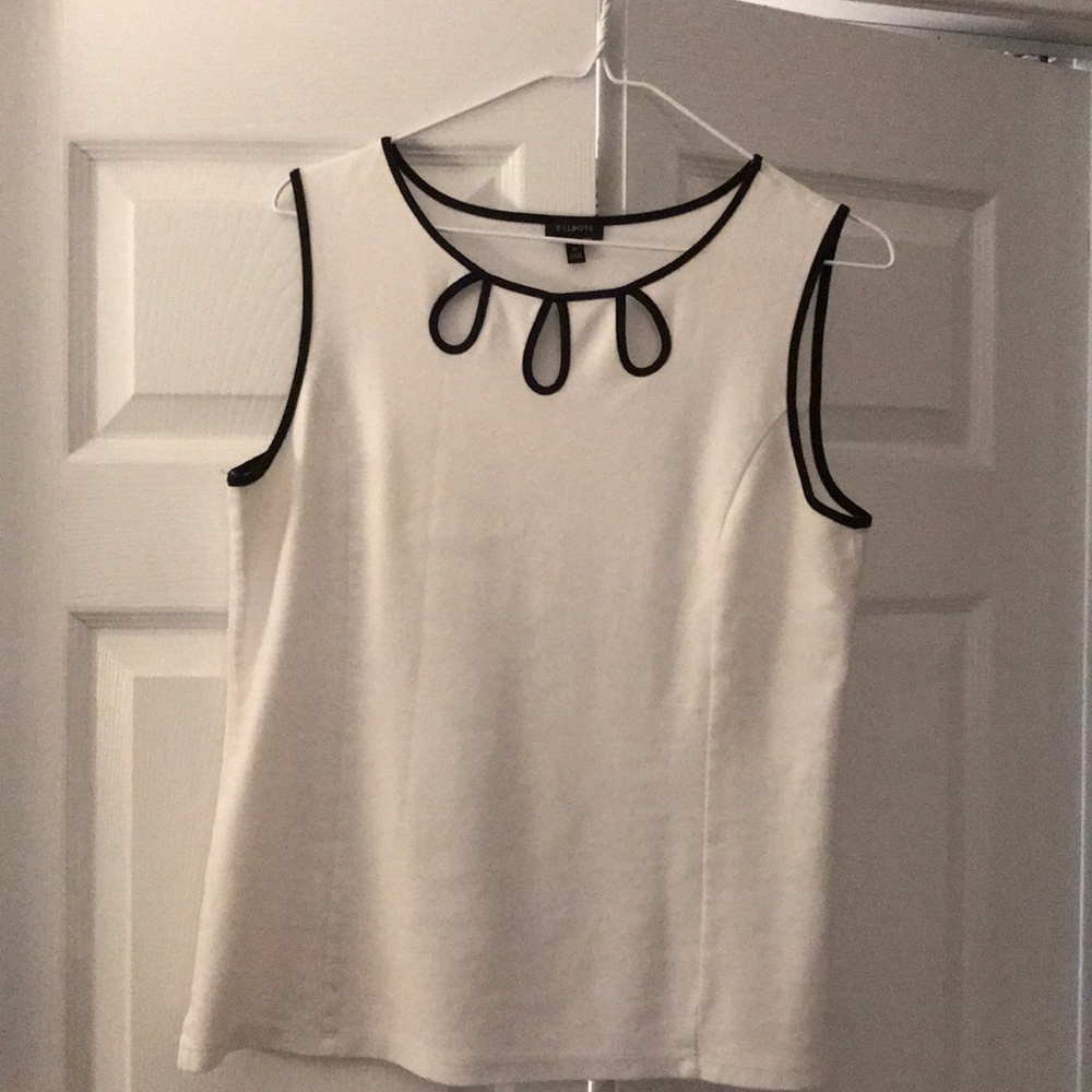 A cotton blend white piped in black top